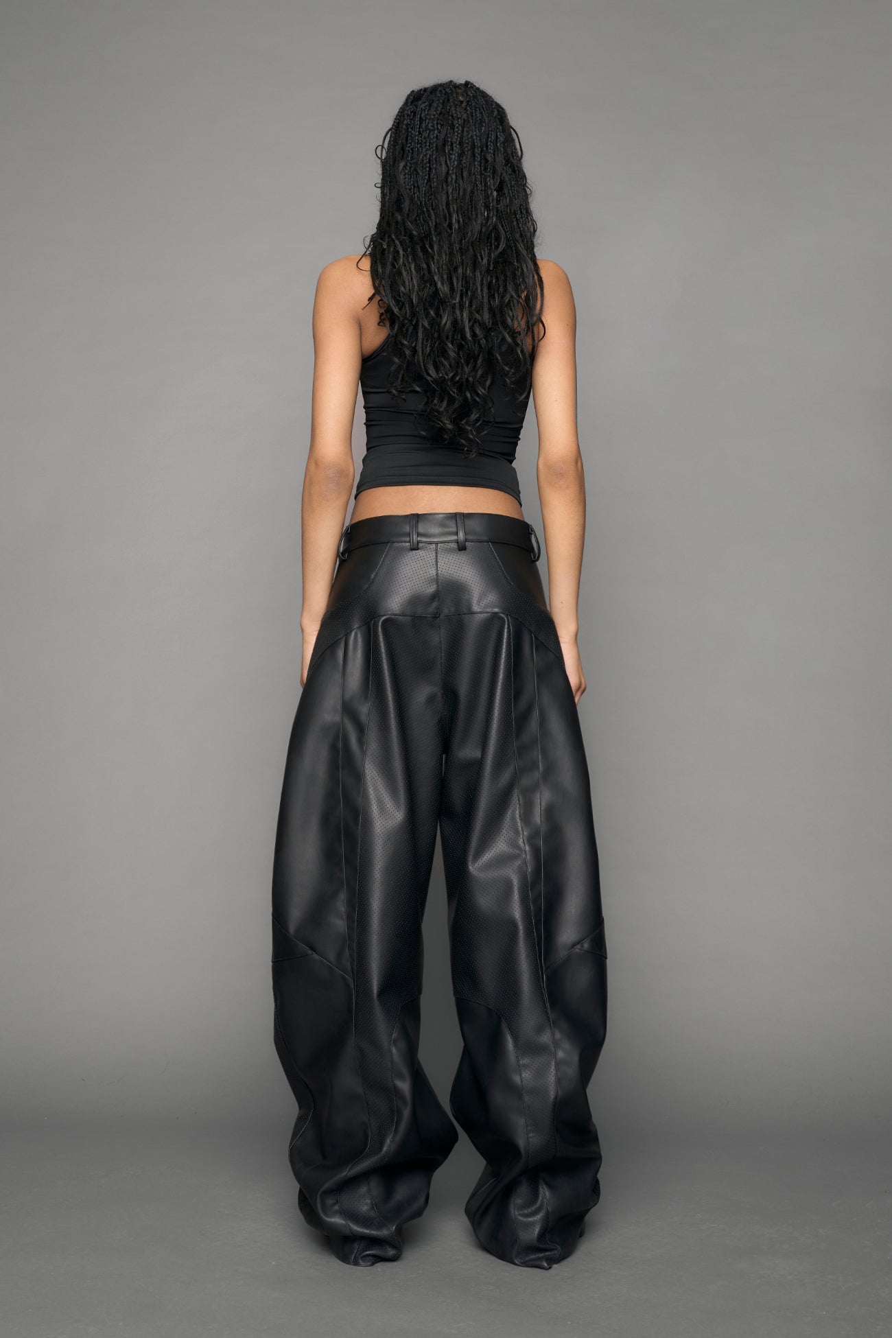 model wearing black vegan moto inspired baggy pants