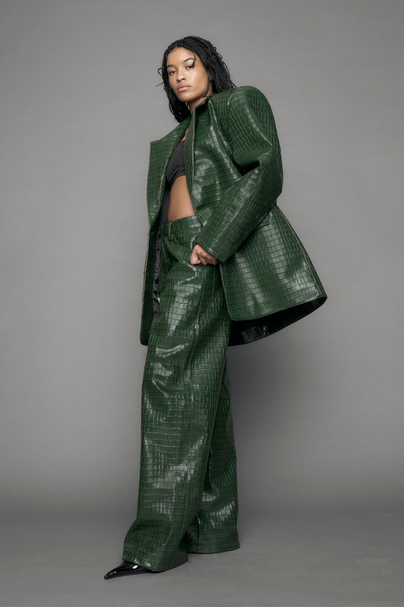 model wearing green vegan leather croc blazer