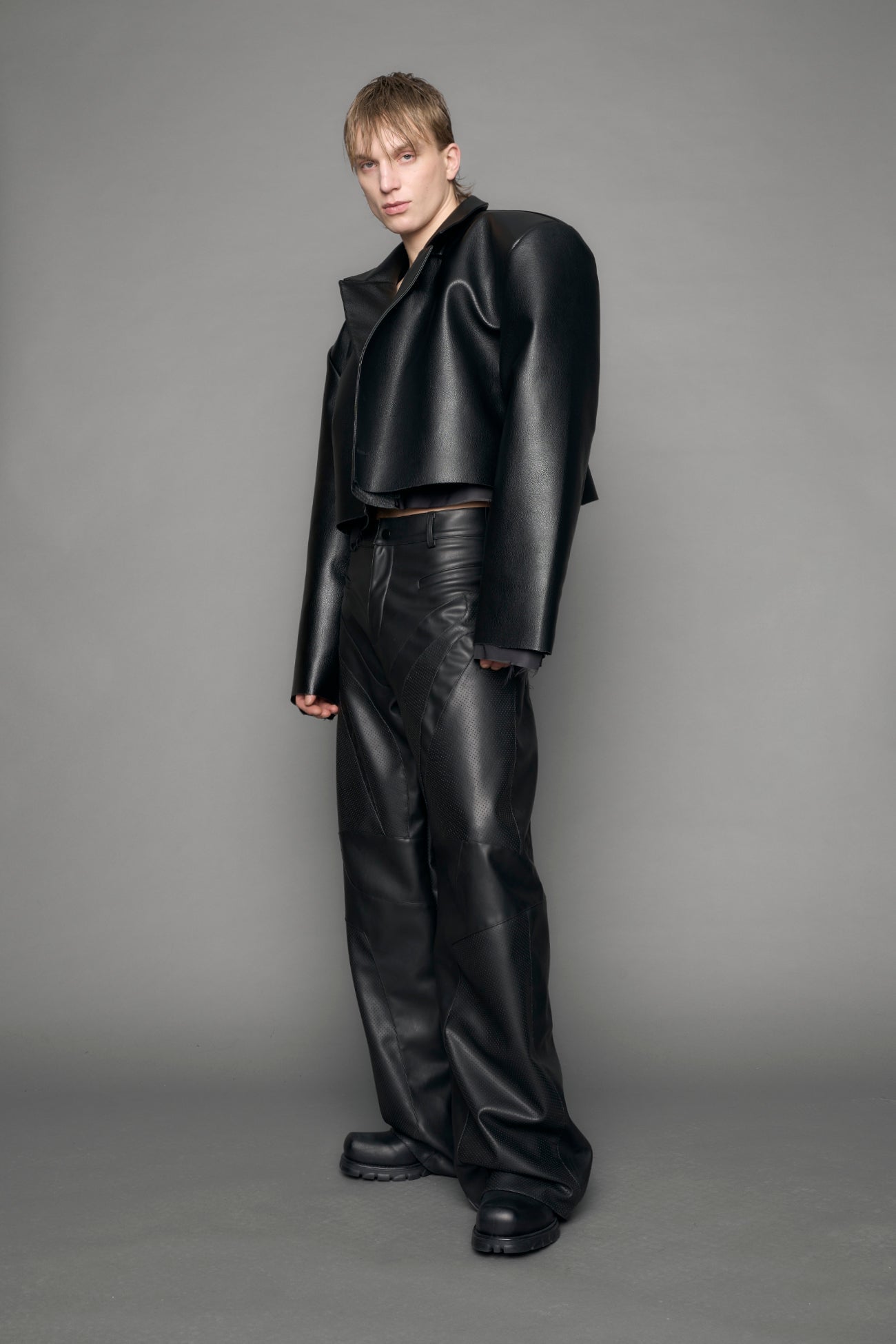 model wearing black vegan leather blazer cropped