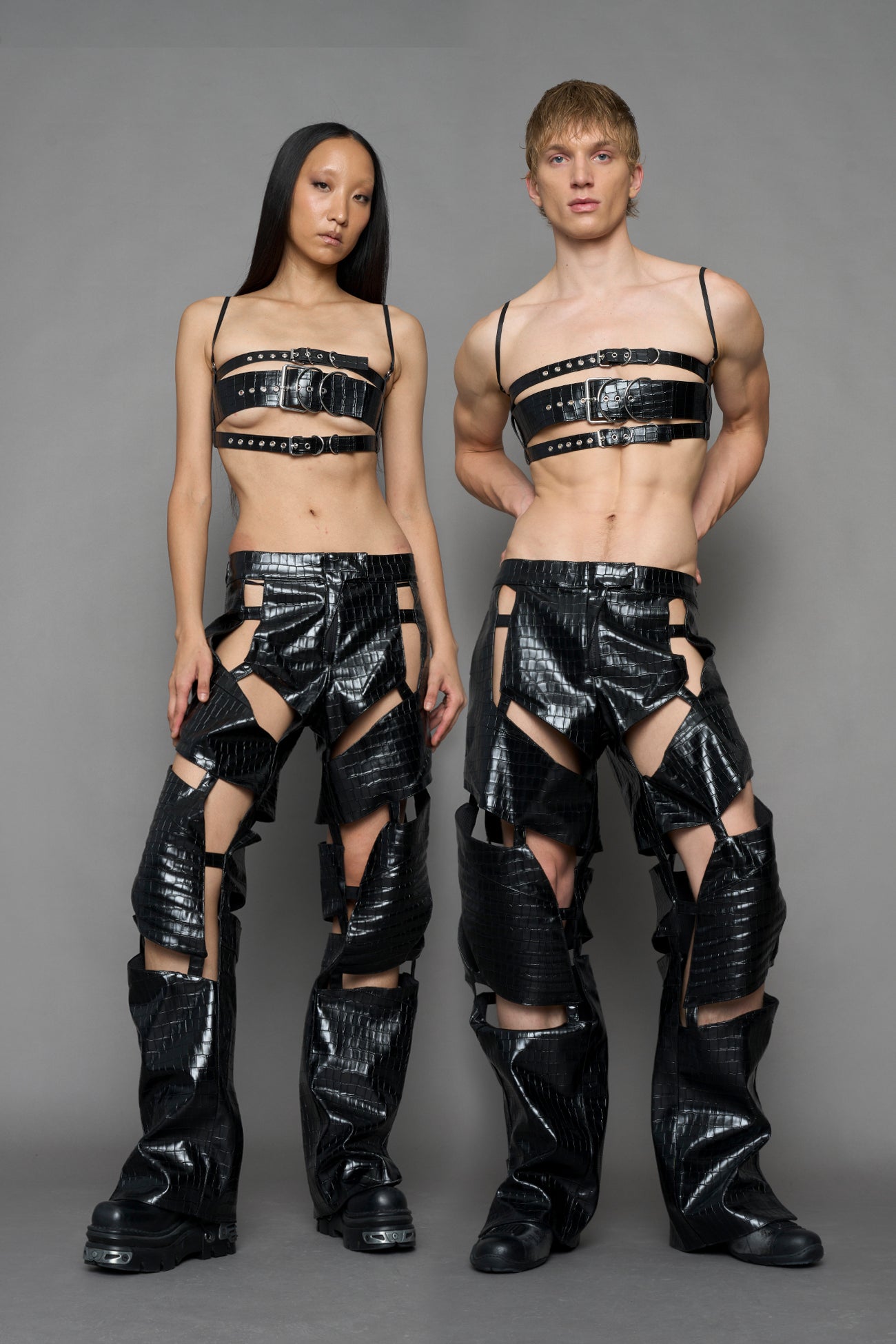 model wearing black vegan leather croc floating pants
