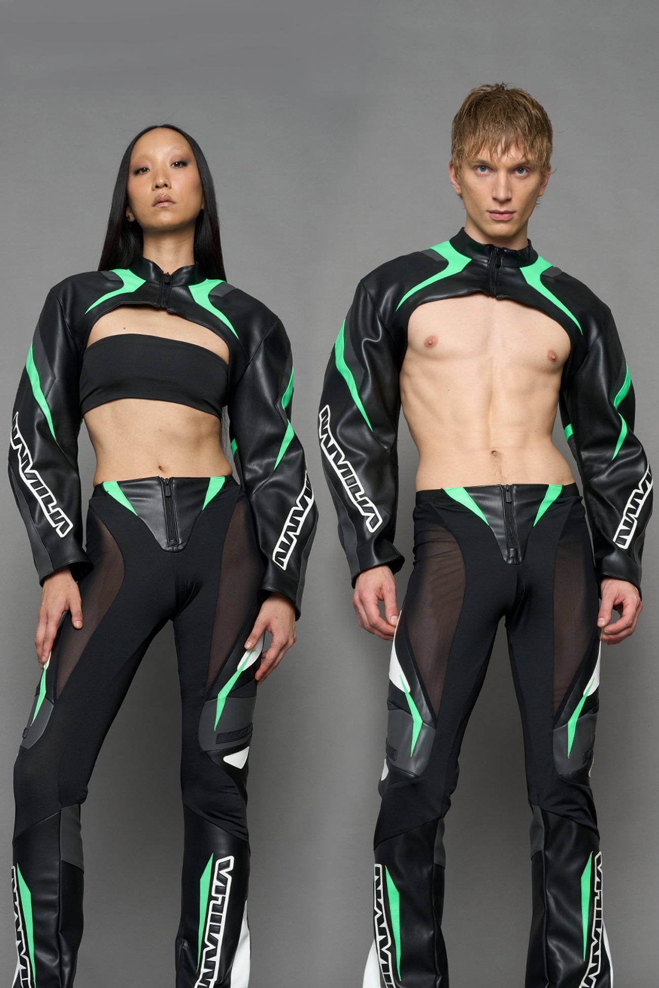 two models wearing black green and white vegan leather jacket