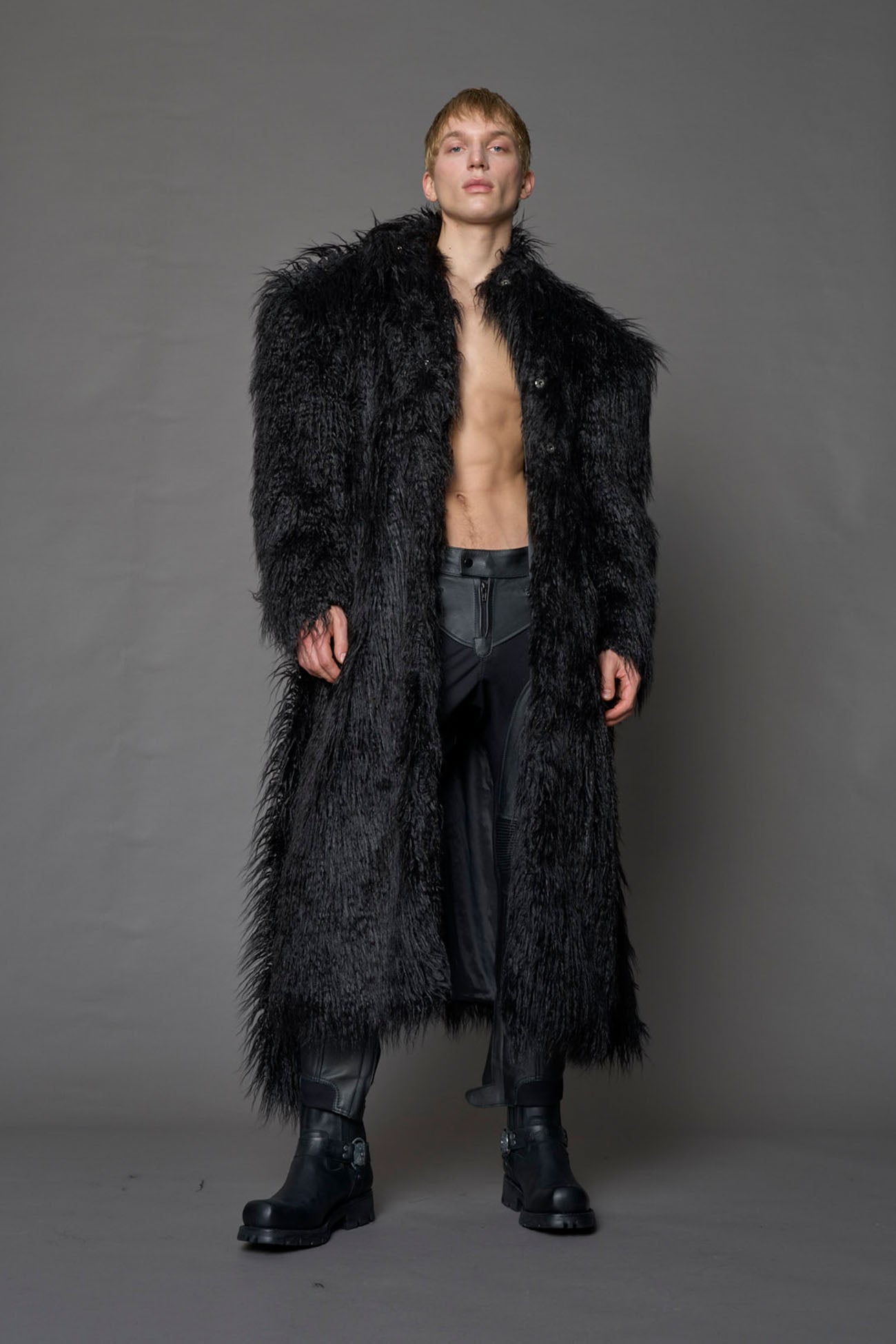 black faux fur coat with shoulder pads and belt