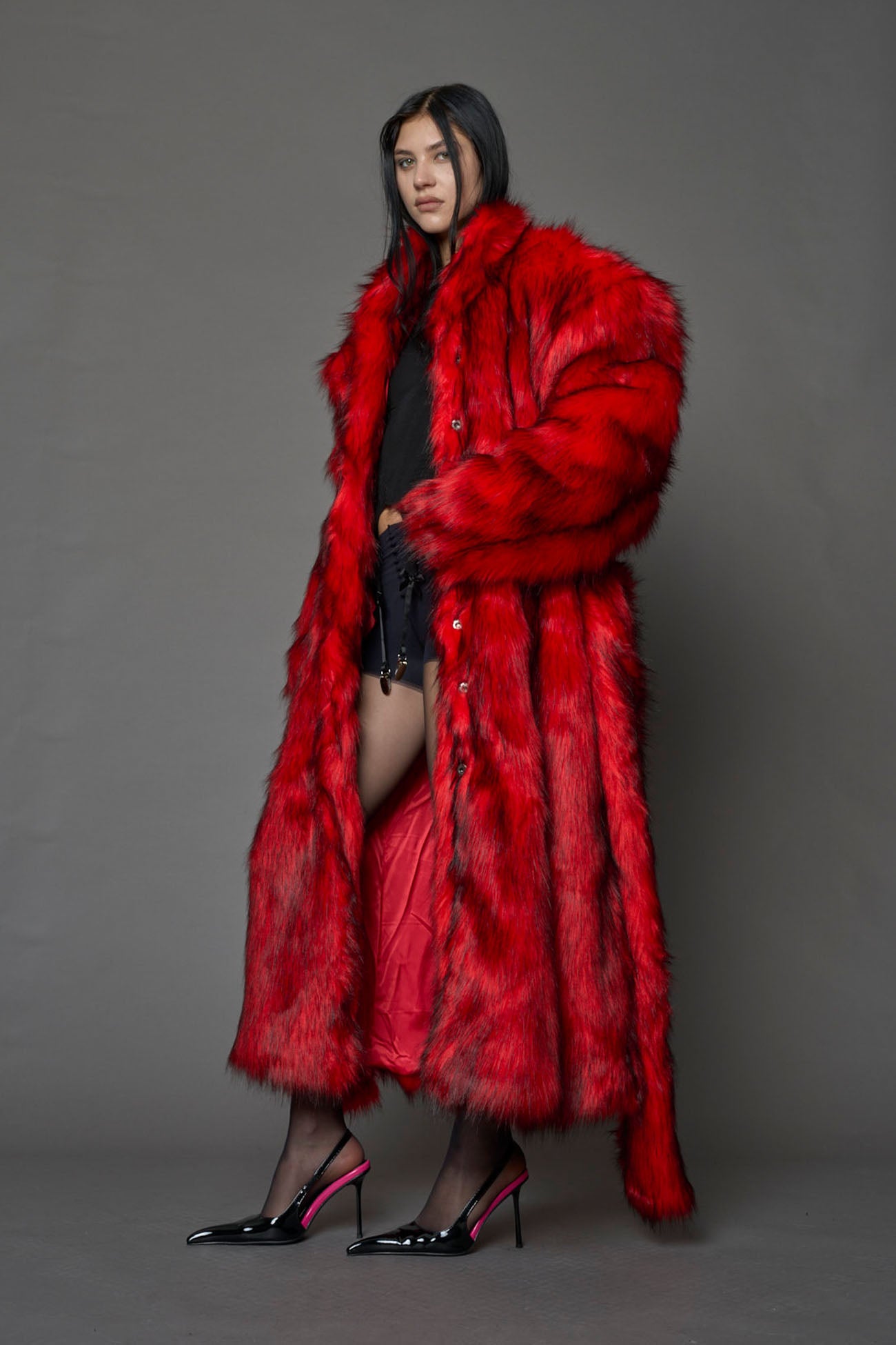 red faux fur coat with shoulder pads and belt
