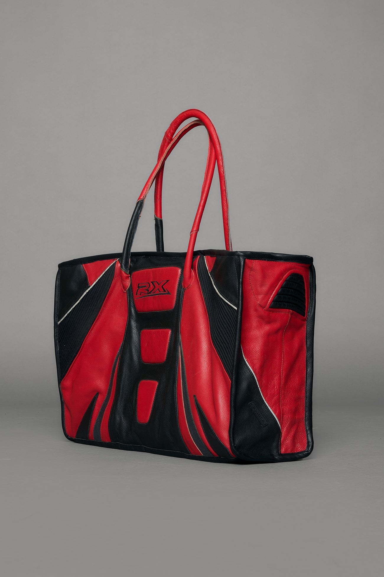 Black and red bag with reflective accents on a gray background