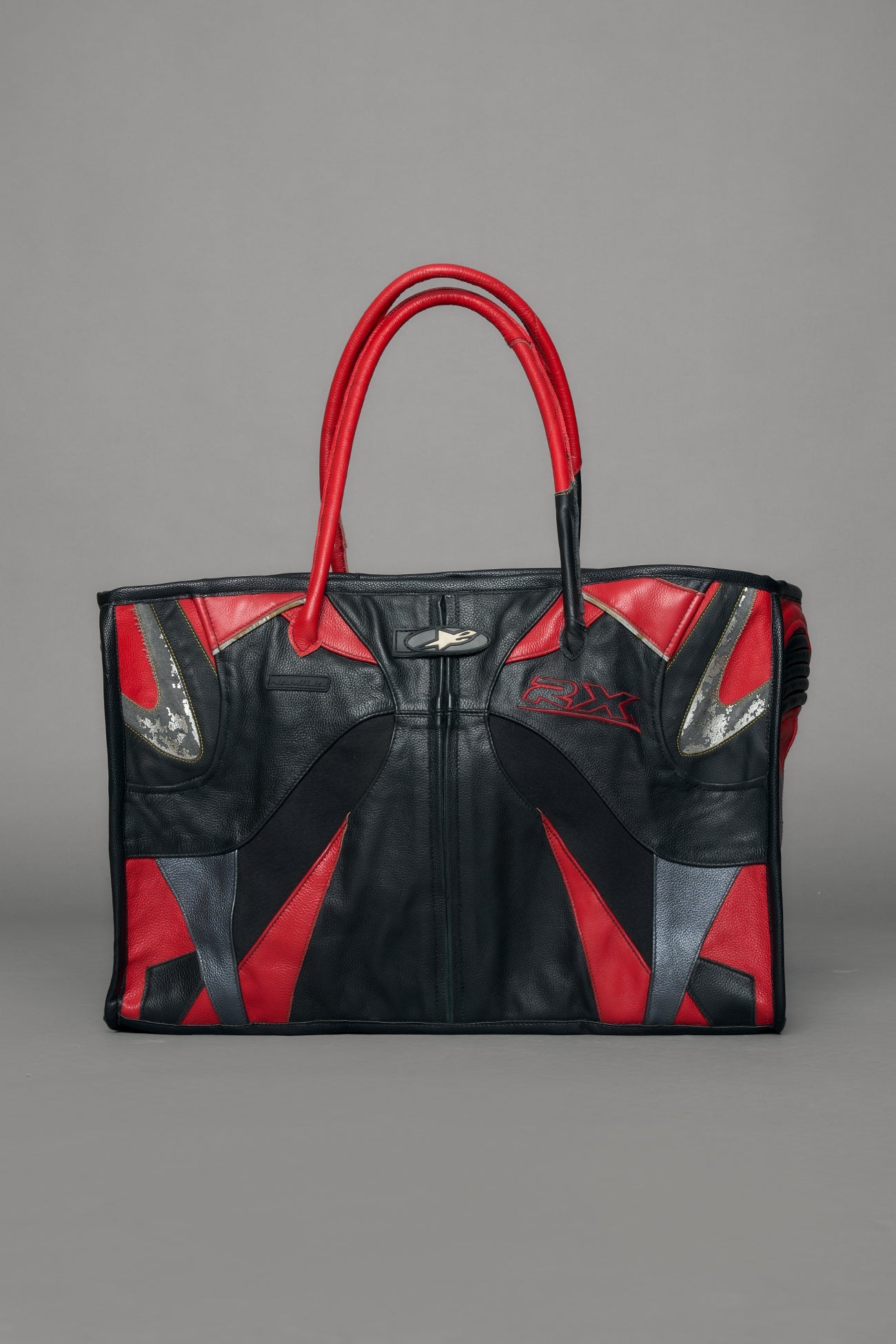 Black and red bag with reflective accents on a gray background