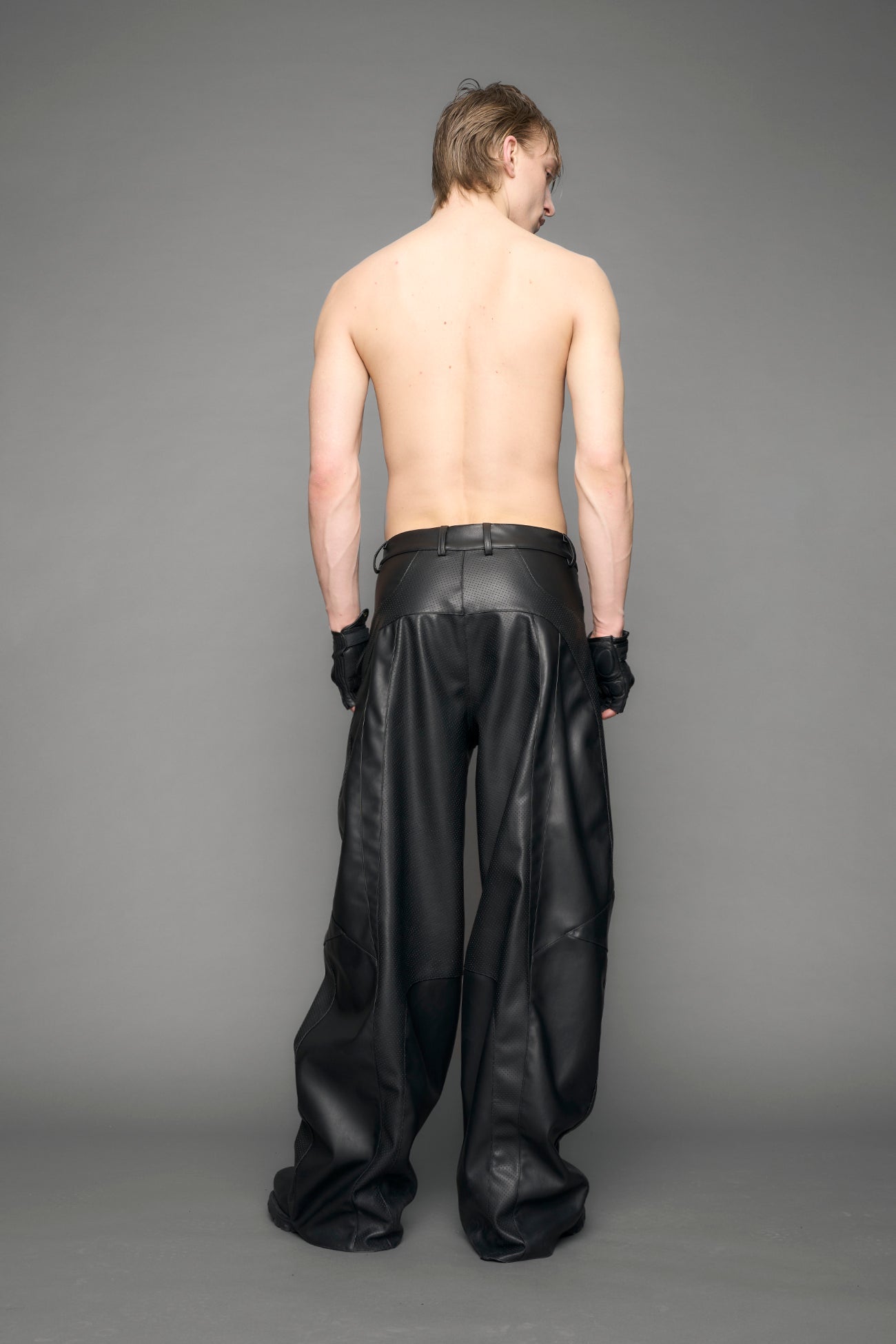 model wearing black vegan moto inspired baggy pants