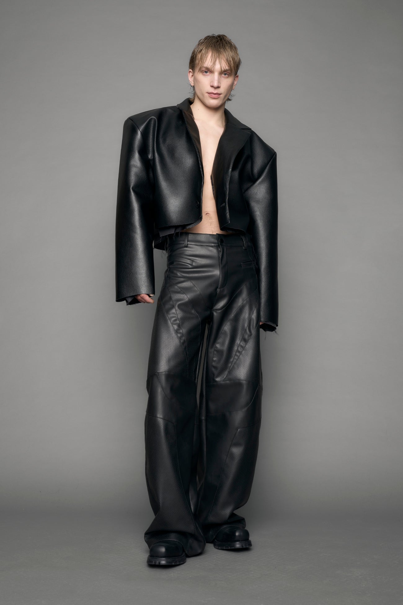 model wearing black vegan leather blazer cropped