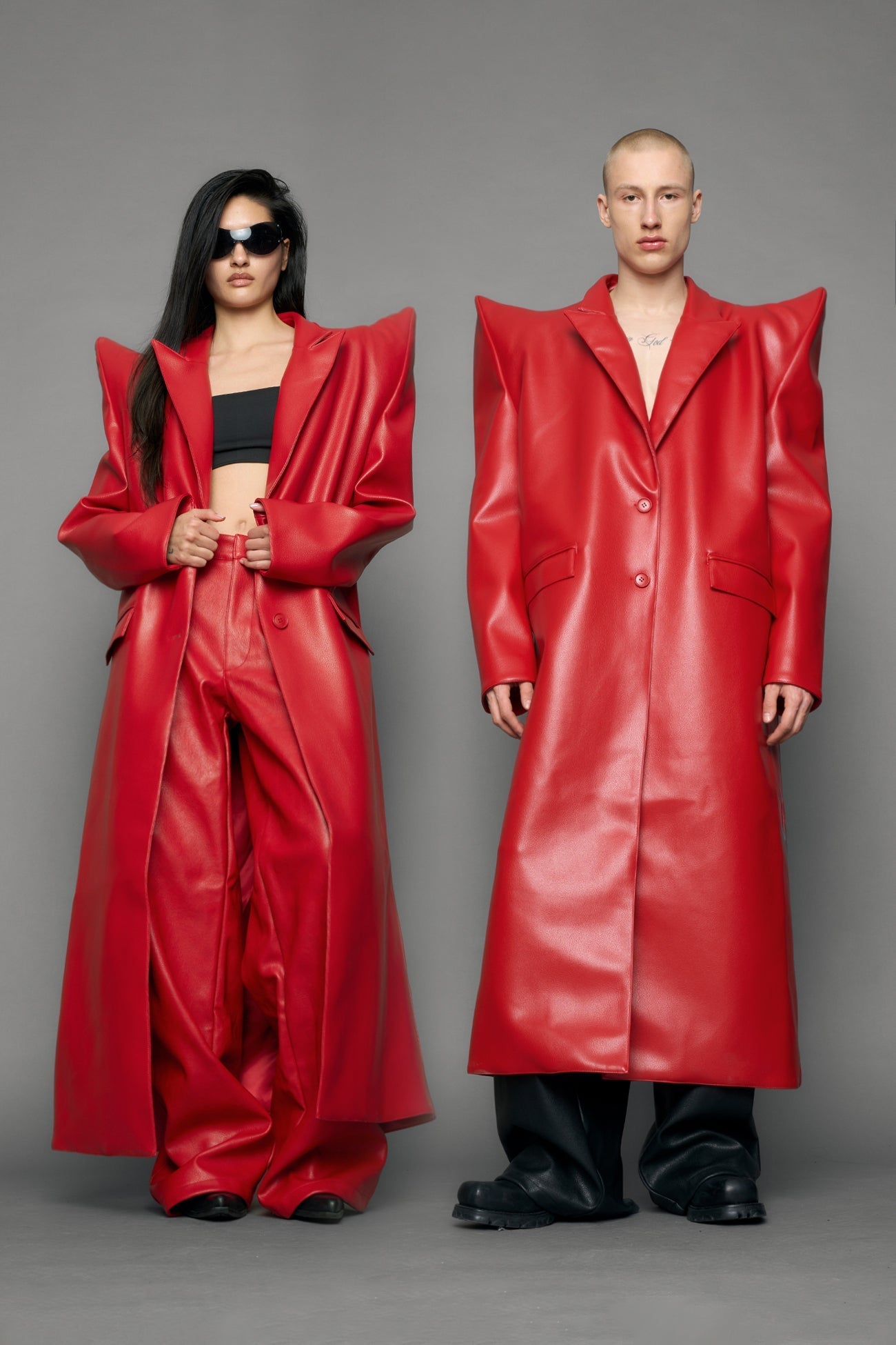 model wearing red pu leather coat with sharp shoulder design