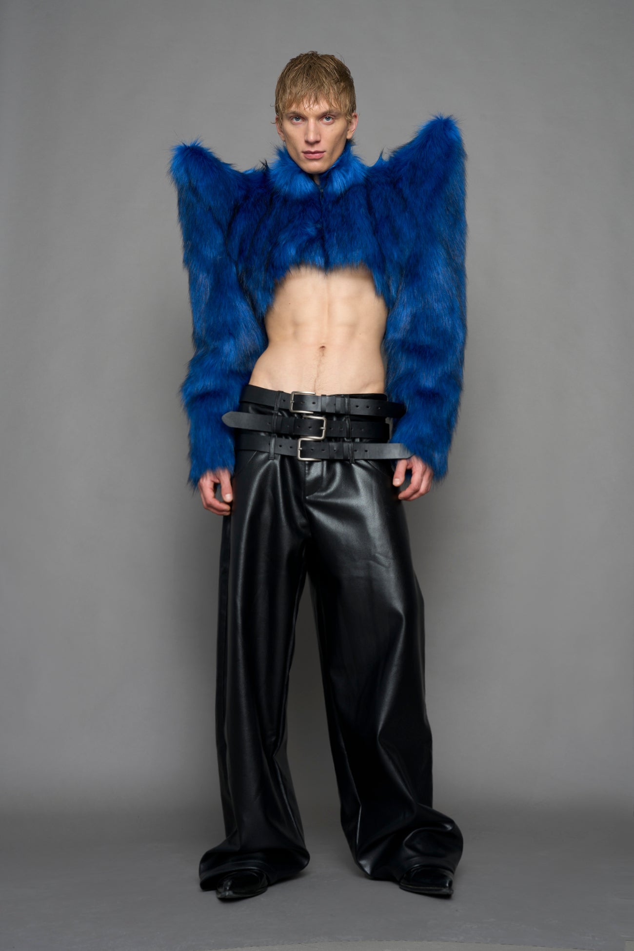 model wearing blue faux fur bolero jacket