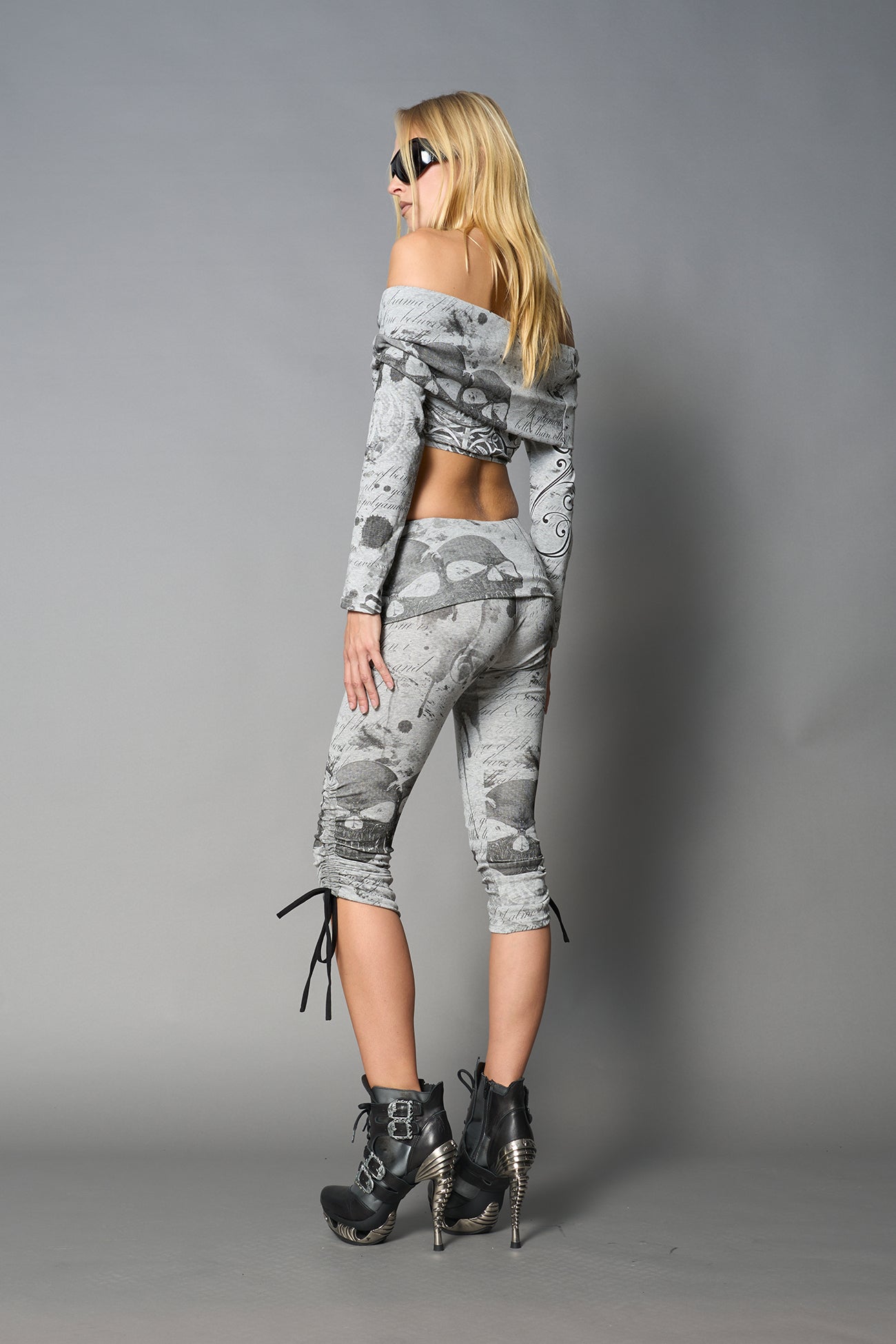 model wearing off shoulder top grey print with foldover detail and long sleeves