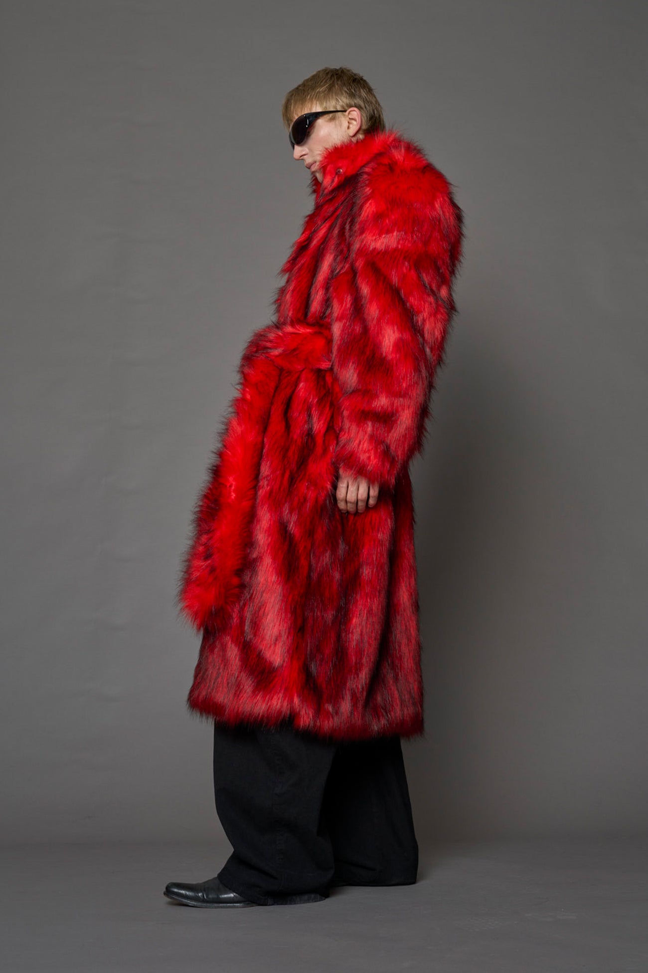 red faux fur coat with shoulder pads and  belt