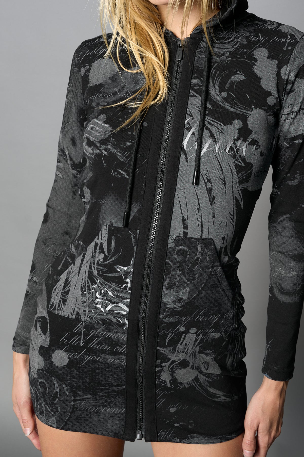 model wearing black print soft jersey short dress with hood and backless cut out
