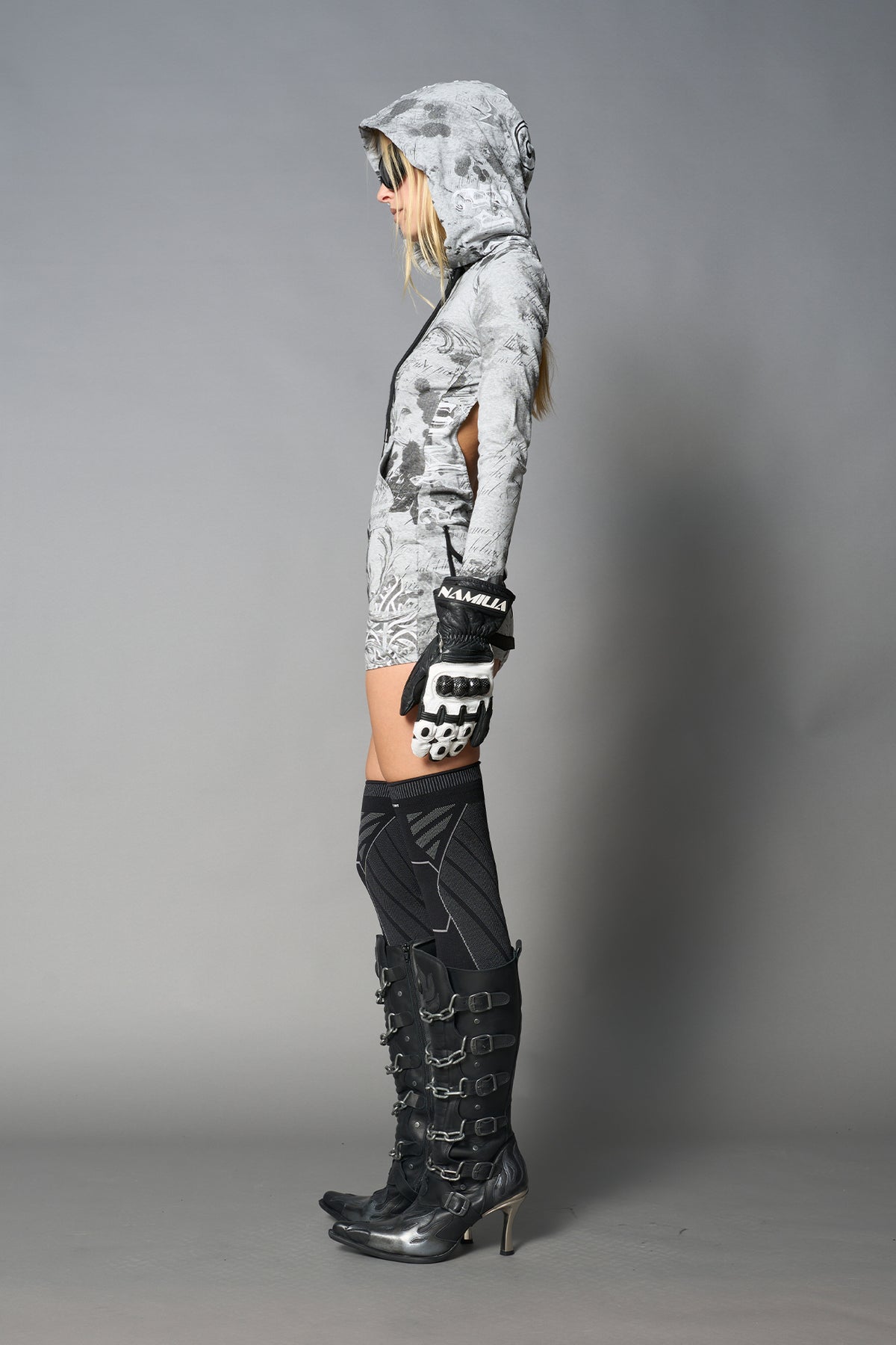 model wearing grey print soft jersey short dress with hood and backless cut out