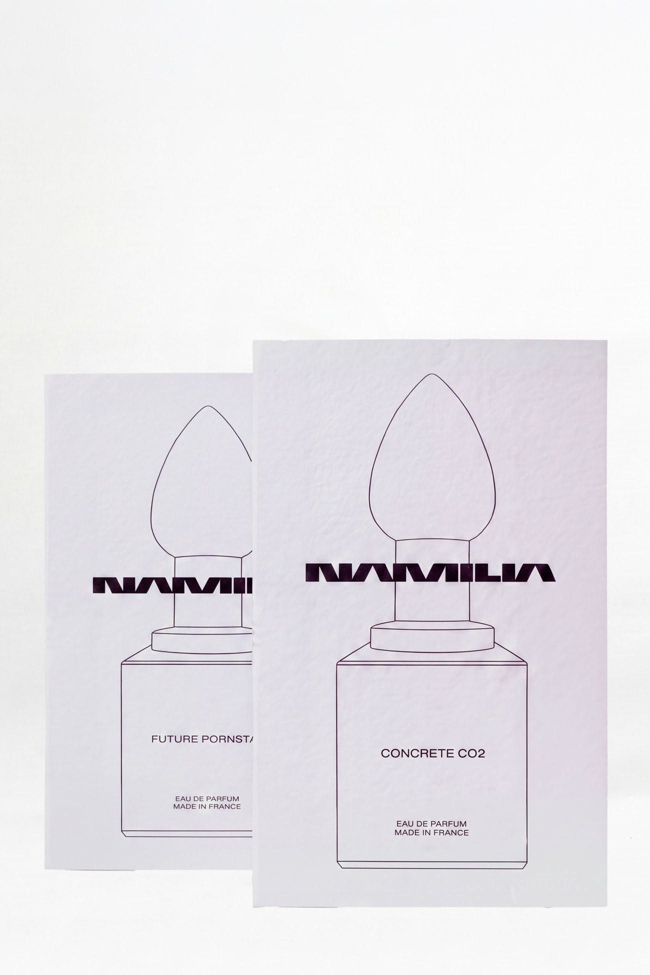 two NAMILIA Parfum tester with black cap and future pornstar and concrete filled inside